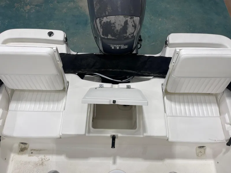 Slide: The Image of 2012 Sea Fox 180XT boat interior with Yamaha engine and white seating. - 14