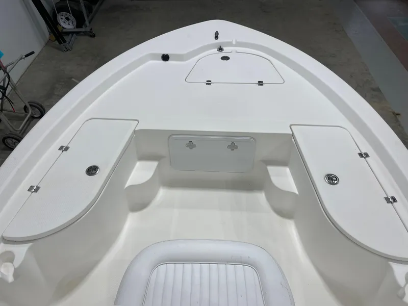 Slide: The Image of 2012 Sea Fox 180XT boat interior with storage compartments and seating. - 19