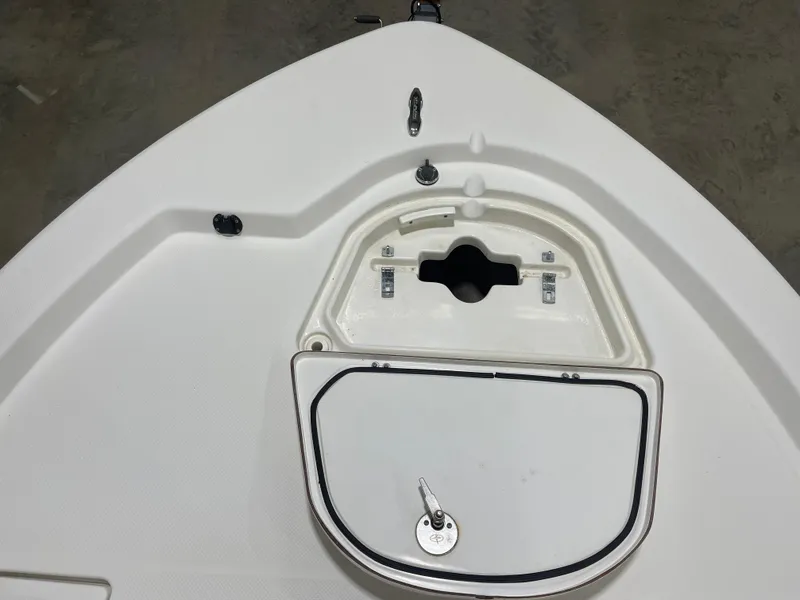 Slide: The Image of Bow storage compartment of a 2012 Sea Fox 180XT boat, featuring a secure latch. - 21