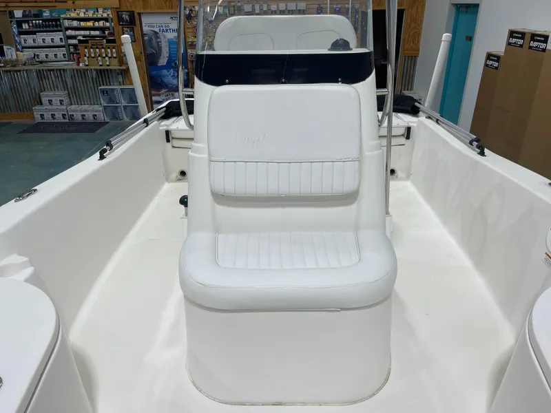 Slide: The Image of 2012 Sea Fox 180XT boat interior with white seating and console. - 22