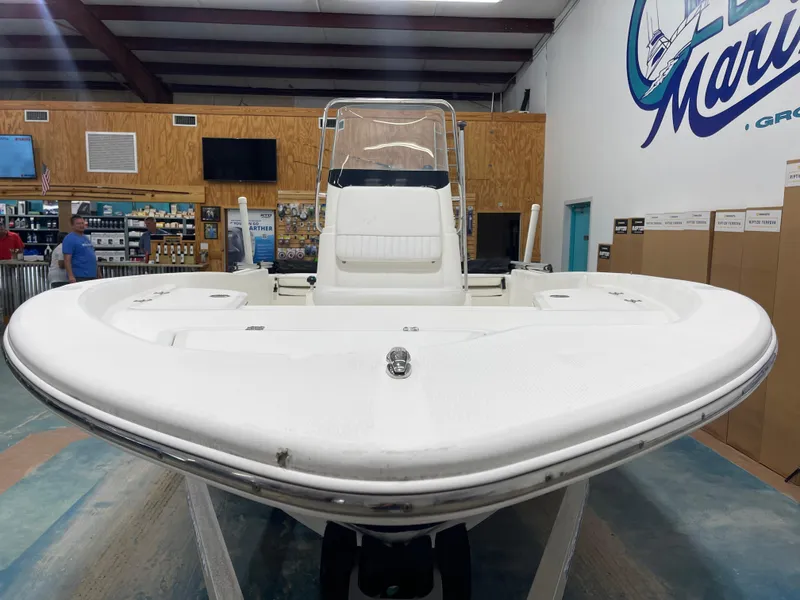Slide: The Image of 2012 Sea Fox 180XT boat displayed indoors at a marine store. - 5