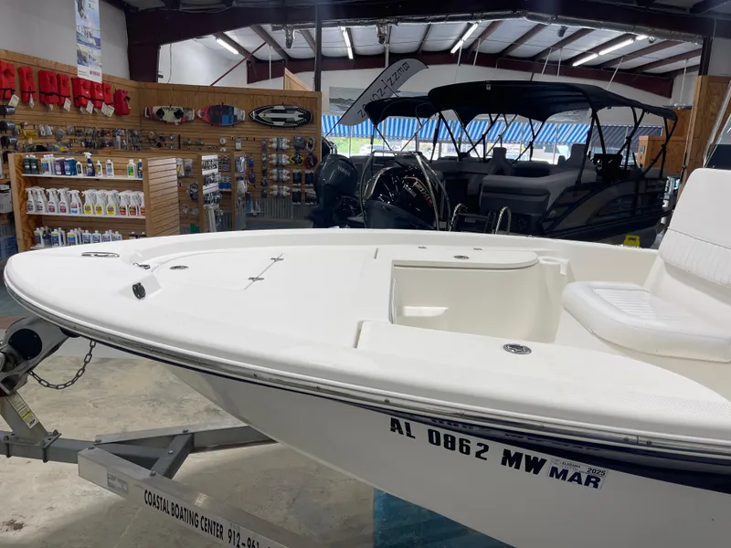 Slide: The Image of 2012 Sea Fox 180XT boat displayed in a showroom with boating accessories. - 7