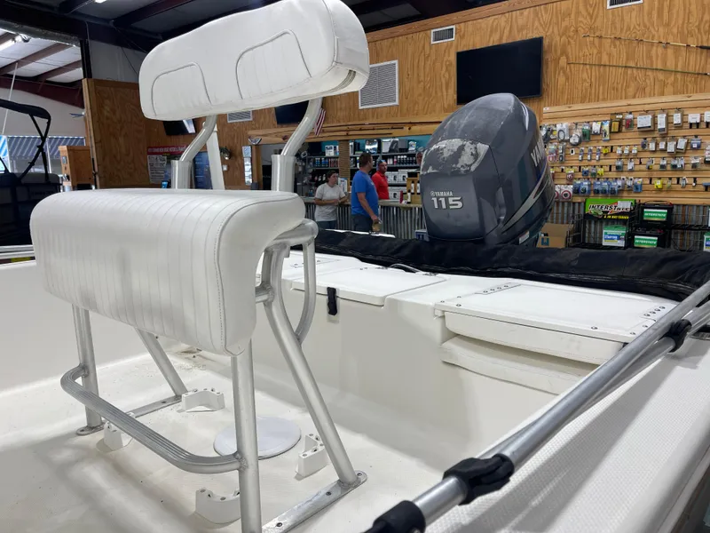 Slide: The Image of 2012 Sea Fox 180XT boat interior with Yamaha 115 outboard motor in showroom. - 9