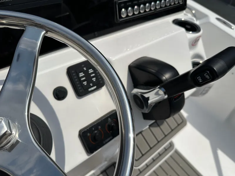 Slide: The Image of Close-up of 2025 Tidewater 198CC boat steering wheel and controls. - 15