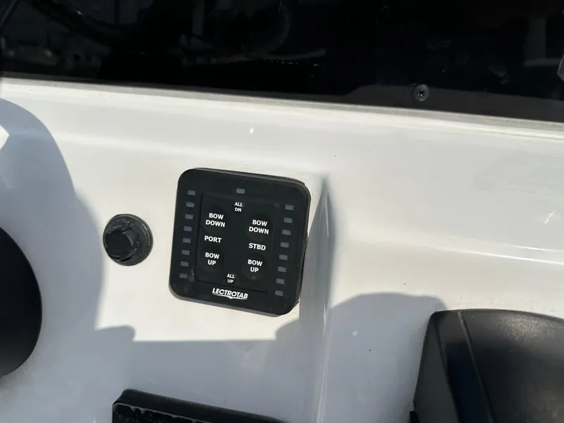 Slide: The Image of Control panel on a 2025 Tidewater 198CC boat dashboard. - 16