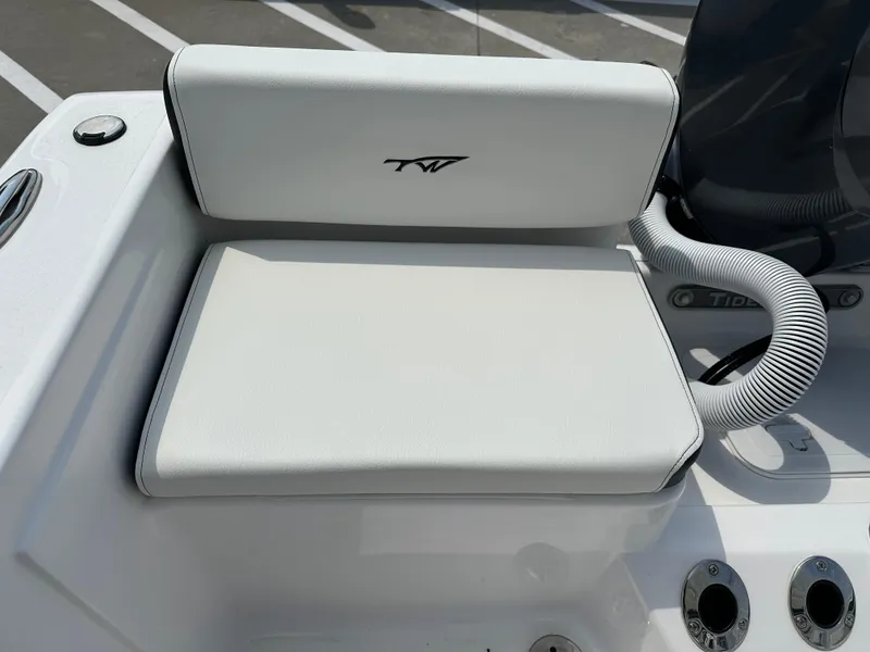 Slide: The Image of 2025 Tidewater 198CC boat seat with logo, white upholstery, and sleek design. - 19