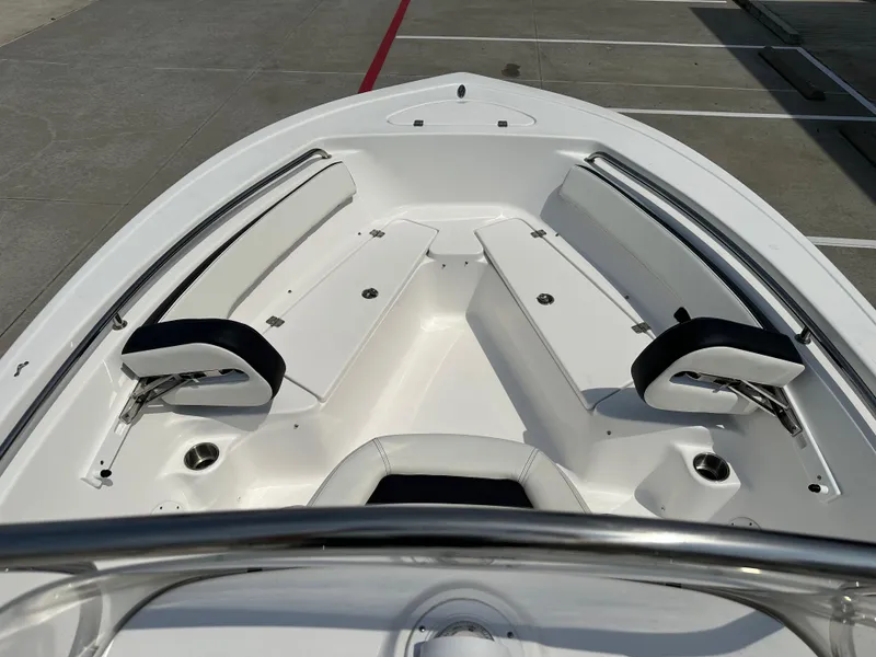 Slide: The Image of 2025 Tidewater 198CC boat interior with white seating and stainless steel railings. - 23