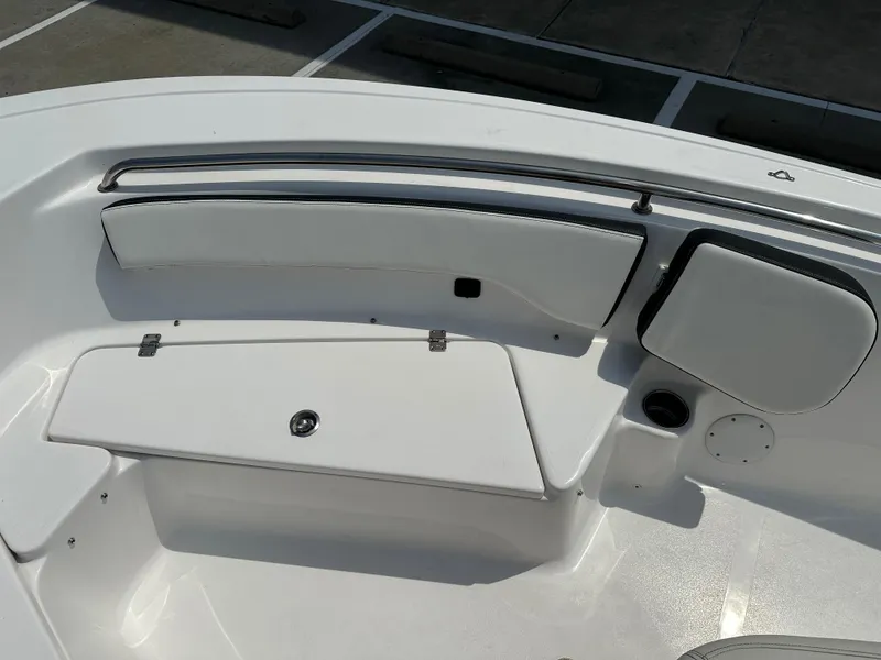Slide: The Image of 2025 Tidewater 198CC boat interior with white seating and storage compartments. - 25