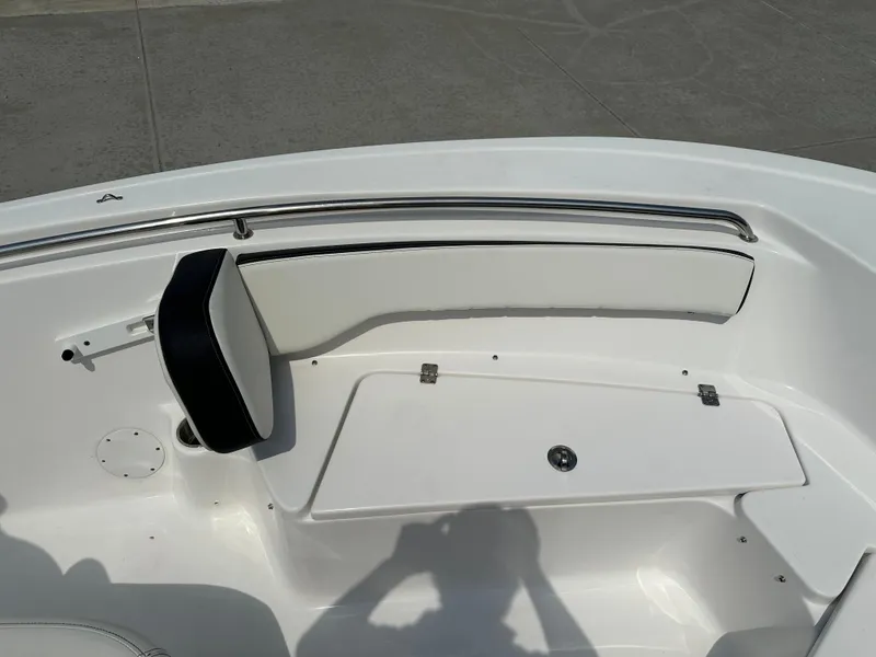 Slide: The Image of 2025 Tidewater 198CC boat interior with white seating and storage compartment. - 26