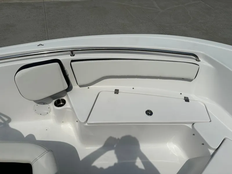 Slide: The Image of 2025 Tidewater 198CC boat interior with white seating and storage compartment. - 27
