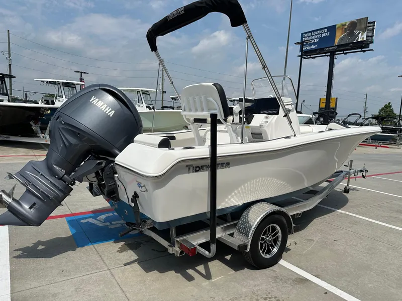 Slide: The Image of 2025 Tidewater 198CC boat with Yamaha engine on trailer in parking lot. - 8