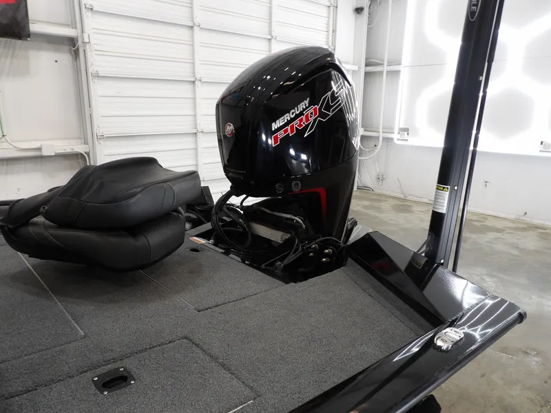 Slide: The Image of 2023 Tracker PRO190TX boat with Mercury Pro outboard motor in a garage. - 10