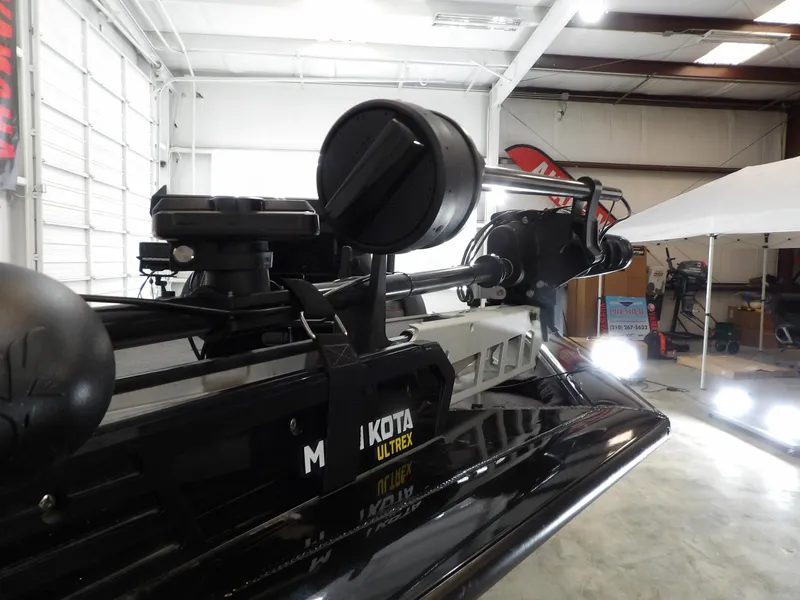 Slide: The Image of 2023 Tracker PRO190TX boat with Minn Kota Ultrex trolling motor in a showroom. - 16