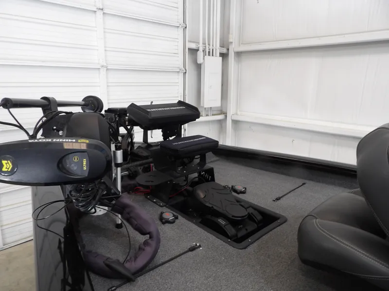 Slide: The Image of 2023 Tracker PRO190TX boat interior with Minn Kota trolling motor and fishing equipment. - 7