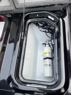 Slide: The Image of 2024 iKon LX 21 storage compartment with fire extinguisher. - 15