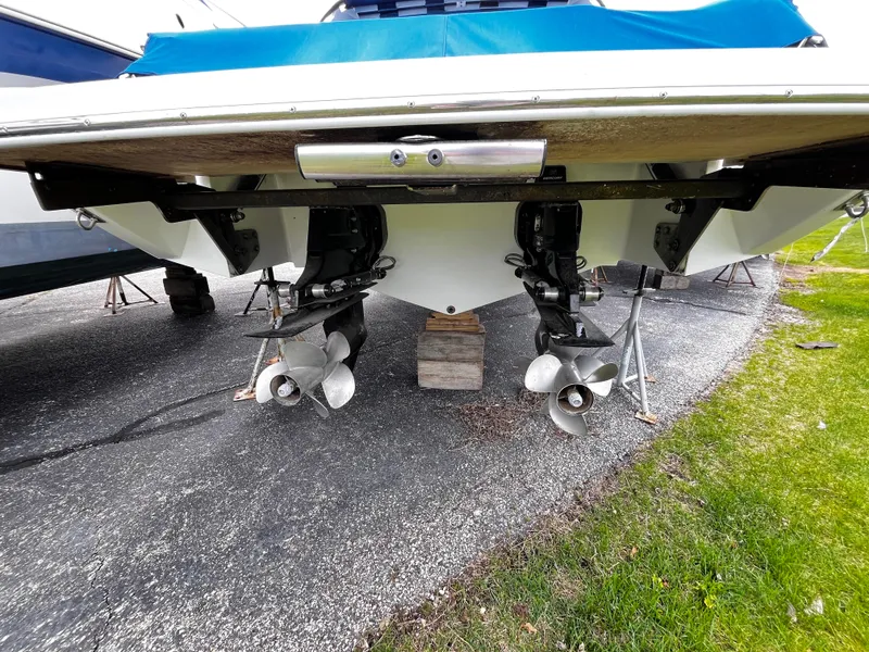 Slide: The Image of 2016 Cobalt R30 boat with dual propellers on a trailer, viewed from the rear. - 15