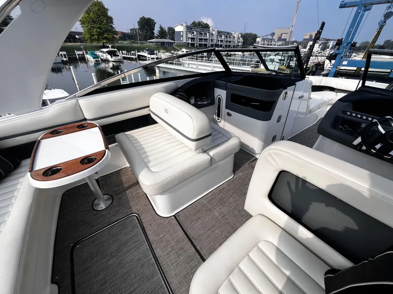 Slide: The Image of Luxurious interior of a 2016 Cobalt R30 boat, featuring plush seating and a sleek dashboard. - 35