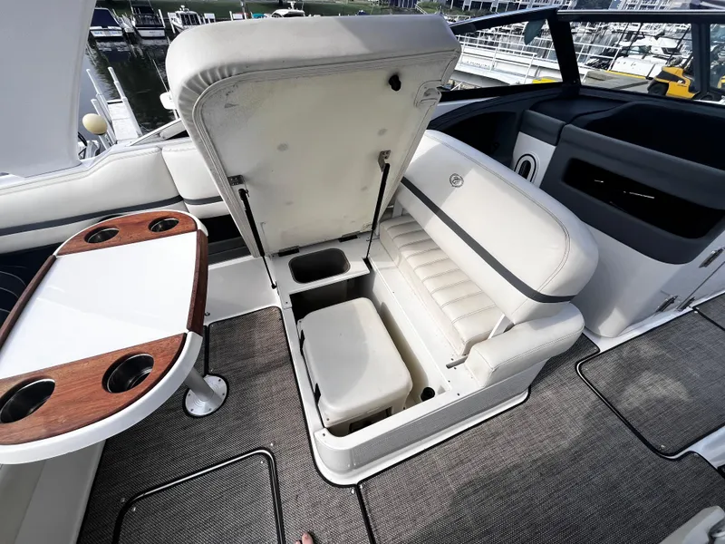 Slide: The Image of 2016 Cobalt R30 boat interior with open storage compartment and seating. - 36