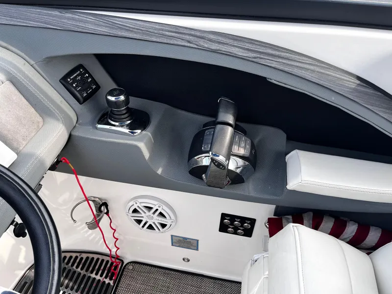 Slide: The Image of Control panel of a 2016 Cobalt R30 boat with joystick and throttle. - 40