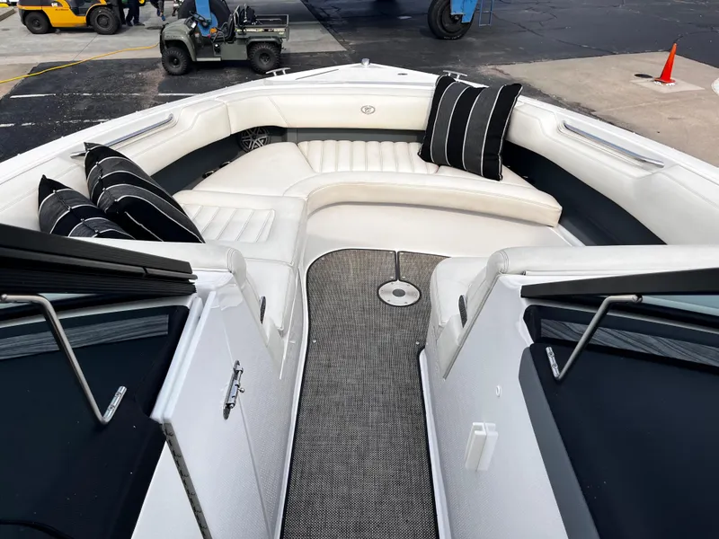 Slide: The Image of 2016 Cobalt R30 boat interior with white seating and black-striped cushions. - 41