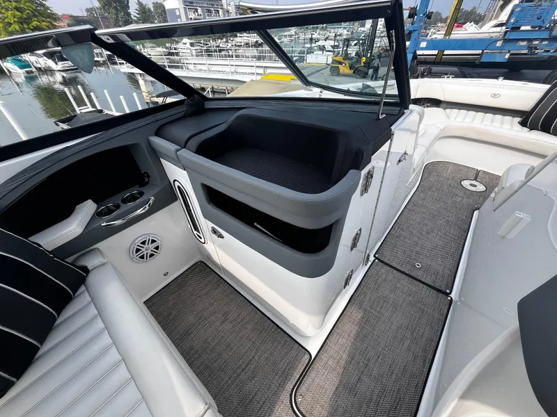 Slide: The Image of Interior of a 2016 Cobalt R30 boat, featuring seating and storage compartments. - 42