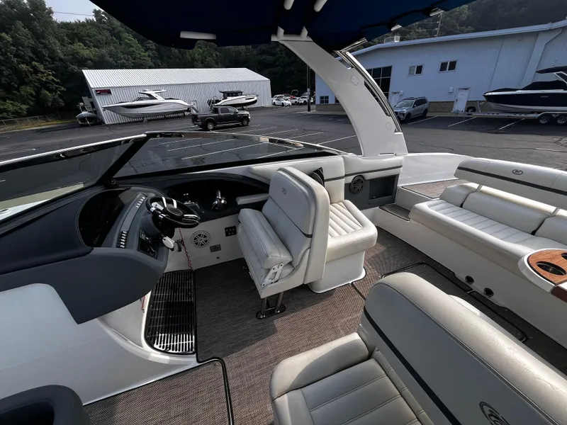 Slide: The Image of Interior of a 2016 Cobalt R30 boat with luxurious seating and modern dashboard. - 48