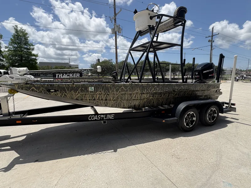 Slide: The Image of 2017 Prodigy 20 x 72 boat on trailer, camouflage design, with Minn Kota and Mercury motors. - 3