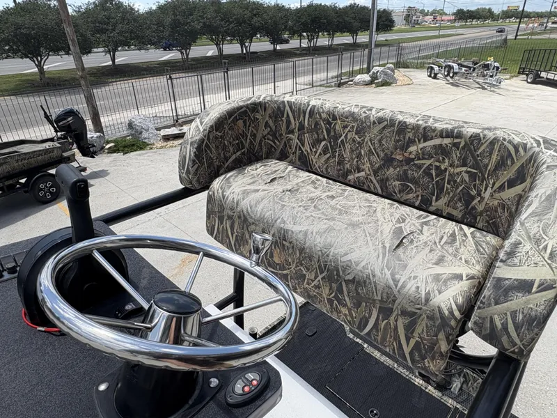 Slide: The Image of Camouflage seat and steering wheel on 2017 Prodigy 20 x 72 boat. - 8