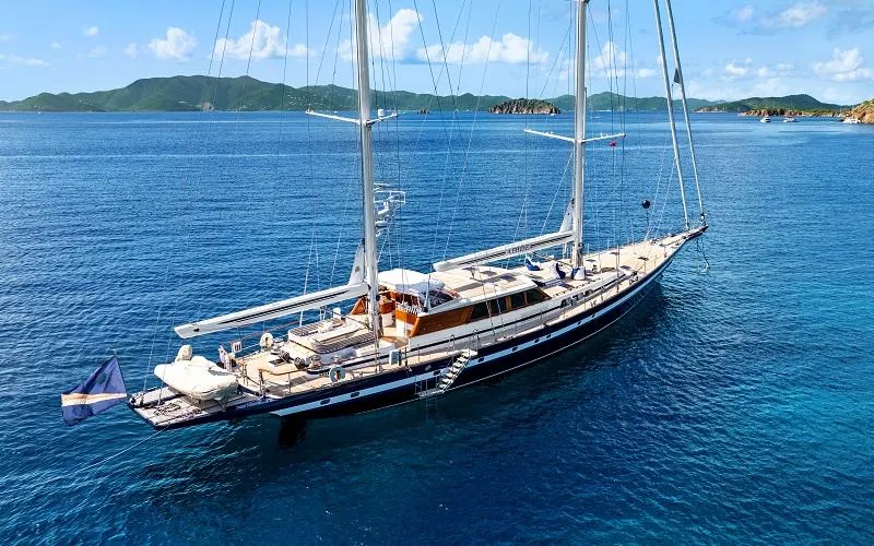 Slide: The Image of Luxurious 2002 Jongert Ketch yacht sailing in clear blue waters. - 1