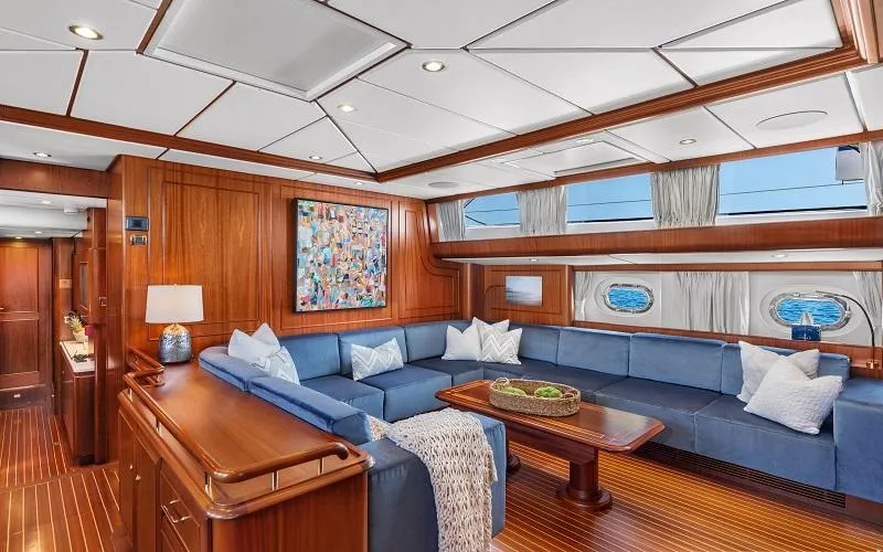 Slide: The Image of Luxurious interior of 2002 Jongert Ketch yacht with elegant wood paneling and blue seating. - 10