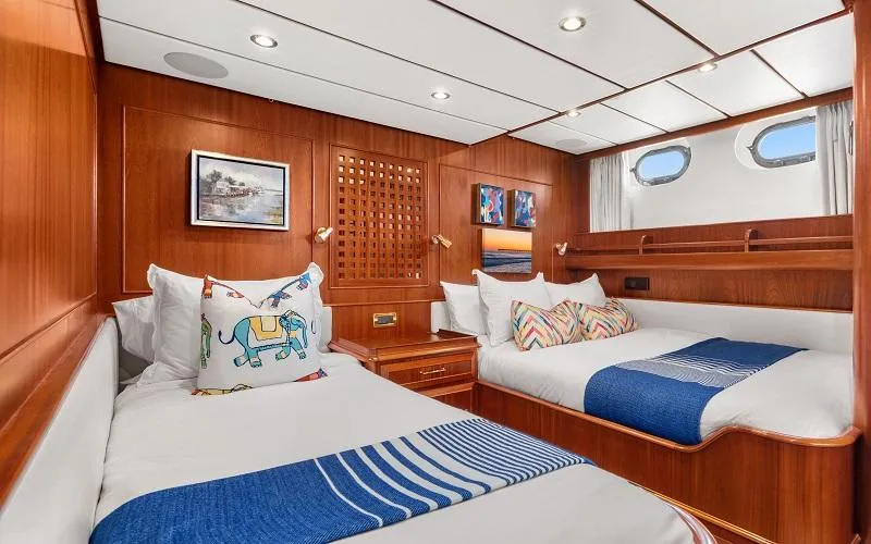 Slide: The Image of Luxurious 2002 Jongert Ketch cabin with twin beds, wooden interior, and nautical decor. - 15