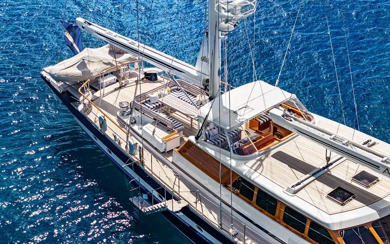 Slide: The Image of Luxurious 2002 Jongert Ketch yacht sailing on clear blue waters. - 21