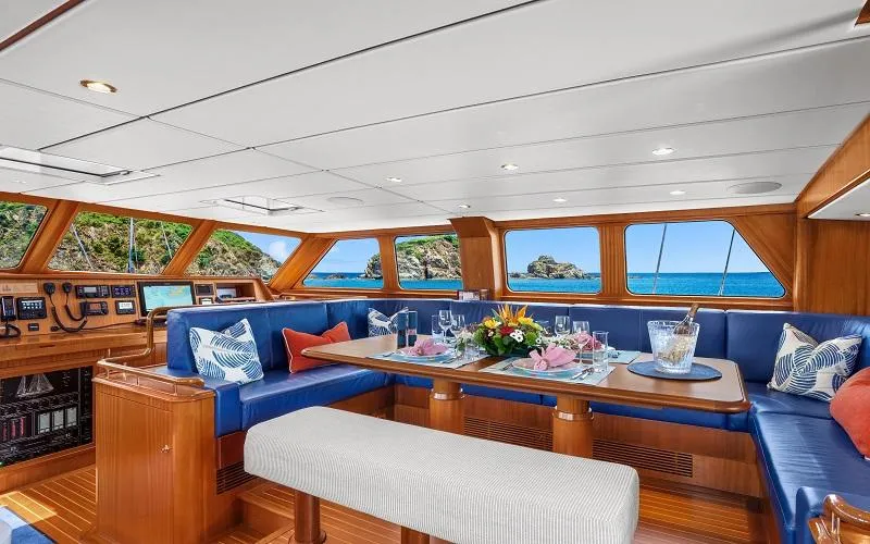 Slide: The Image of Luxurious 2002 Jongert Ketch yacht interior with elegant dining area and ocean view. - 3