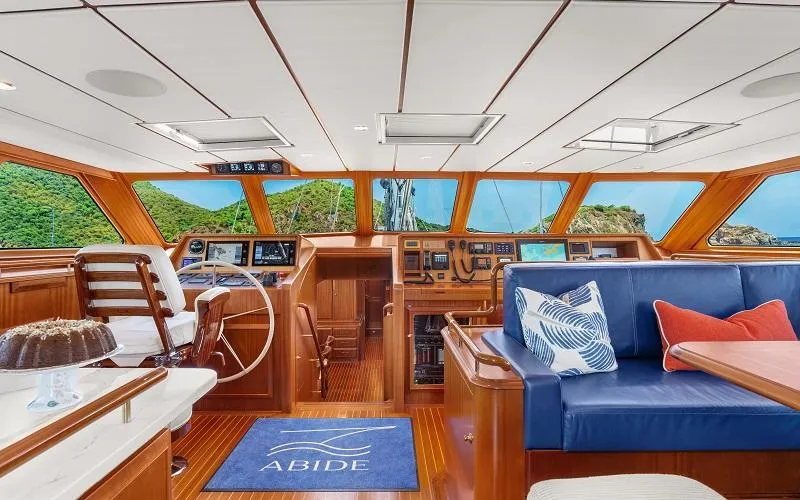 Slide: The Image of Luxurious 2002 Jongert Ketch yacht interior with elegant wood finish and plush seating. - 4