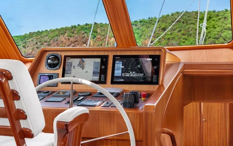 Slide: The Image of Luxurious 2002 Jongert Ketch yacht cockpit with navigation screens and wooden finish. - 5