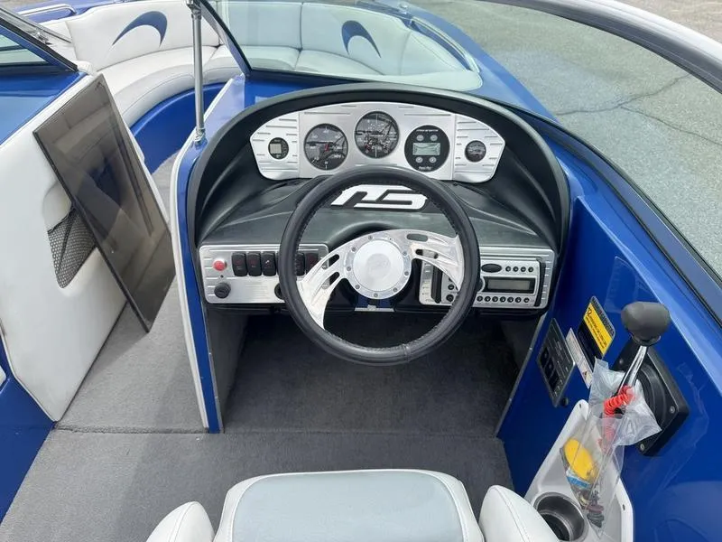 Slide: The Image of 2007 MB TOMCAT boat dashboard with steering wheel and control panel. - 11