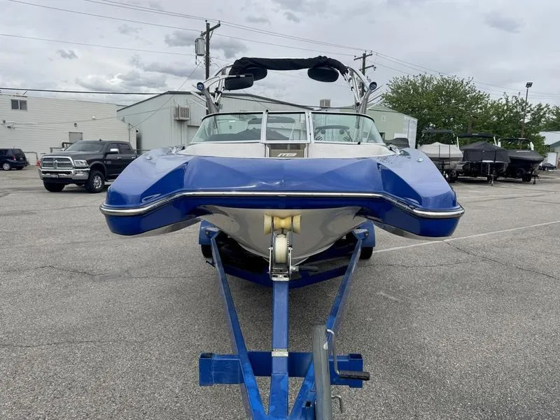 Slide: The Image of Blue 2007 MB TOMCAT boat on trailer in parking lot, front view. - 4
