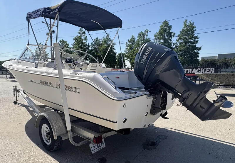 Slide: The Image of 2007 Sea Hunt Escape 200 boat with Yamaha outboard motor on a trailer. - 11