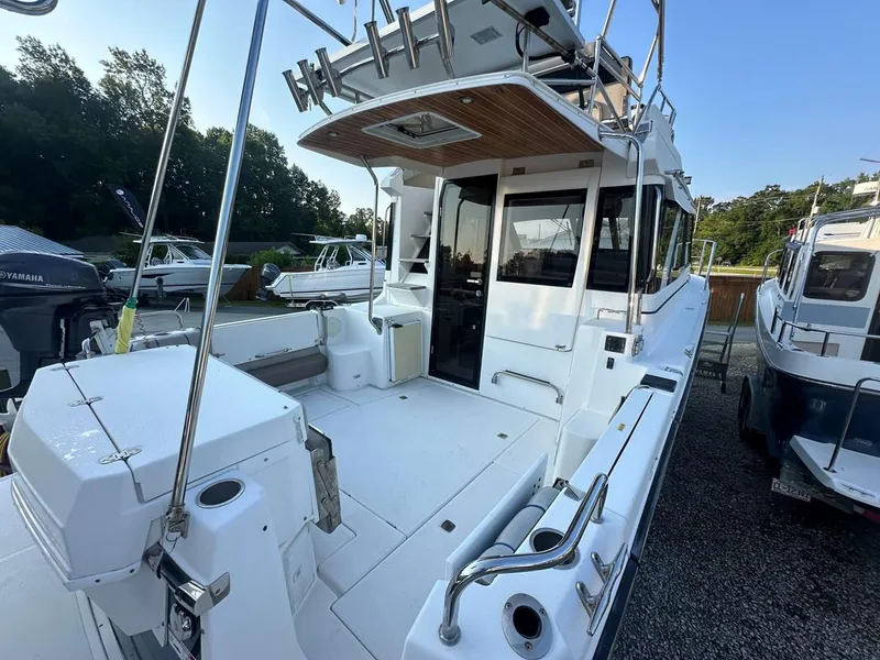 Slide: The Image of 2020 Cutwater C-32 CB boat with spacious deck and modern design. - 6