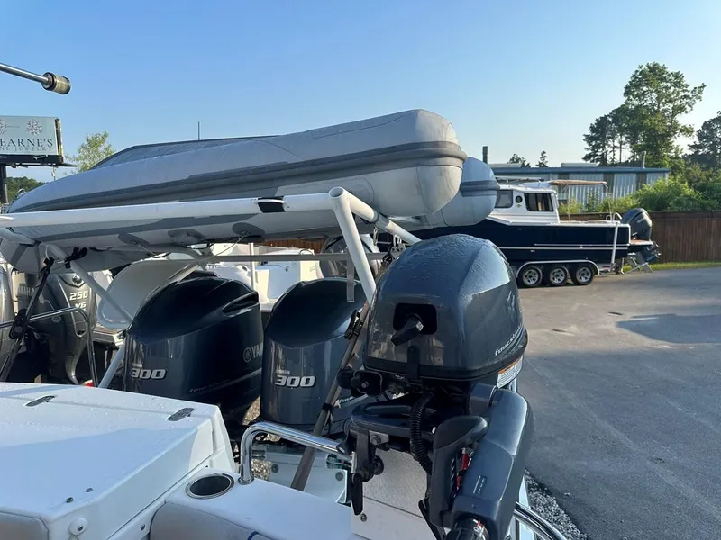 Slide: The Image of 2020 Cutwater C-32 CB boat with powerful outboard engines and inflatable dinghy on deck. - 8