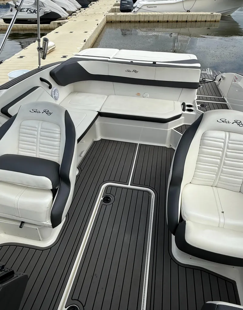 Slide: The Image of 2018 Sea Ray SPX 210 boat interior with sleek seating and modern design. - 10