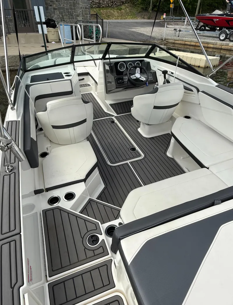Slide: The Image of 2018 Sea Ray SPX 210 boat interior with modern seating and sleek design. - 4