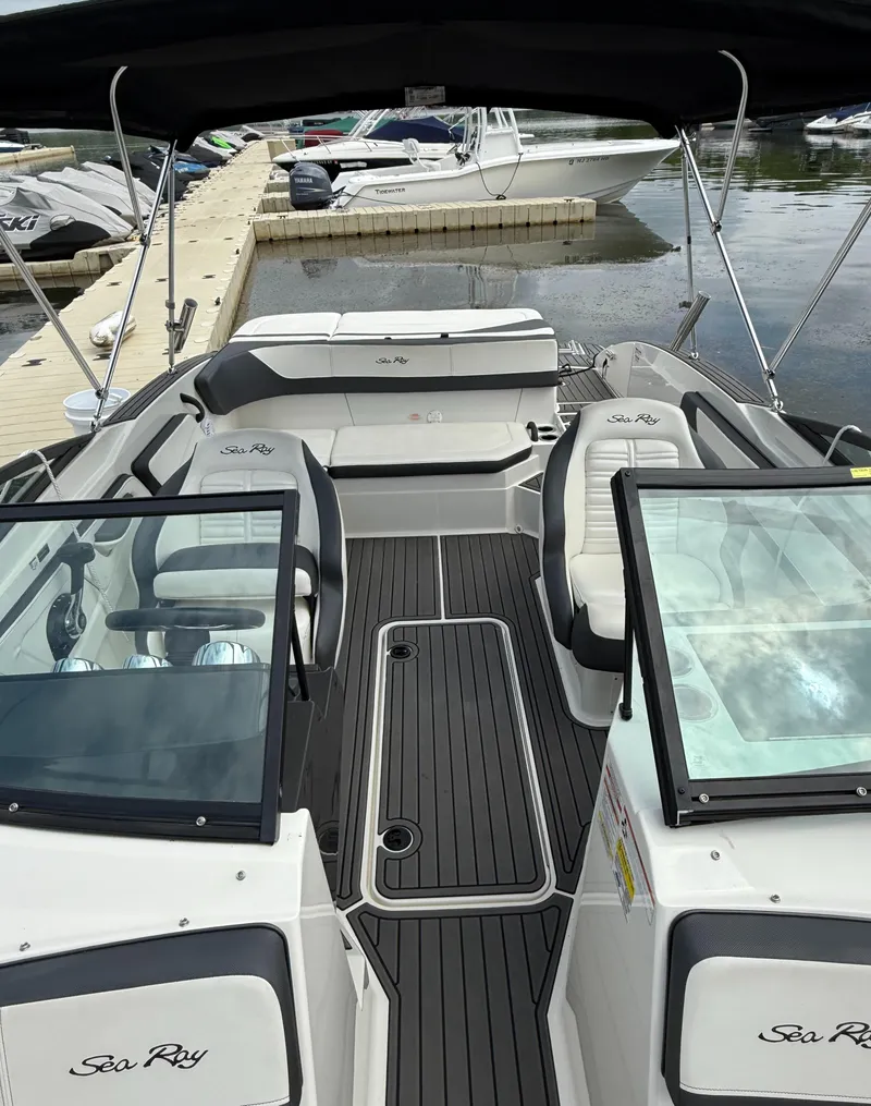 Slide: The Image of 2018 Sea Ray SPX 210 boat interior with sleek seating and modern design. - 7