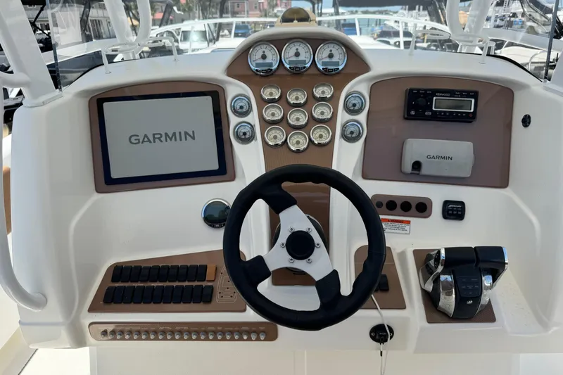 Slide: The Image of Control panel of a 2010 Deep Impact 36 DI boat with Garmin navigation system. - 11