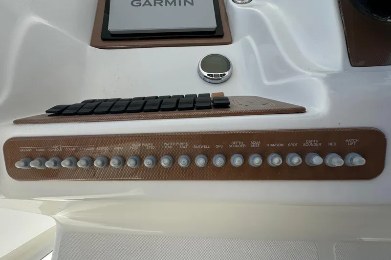 Slide: The Image of Control panel of a 2010 Deep Impact 36 DI boat with Garmin navigation system. - 15