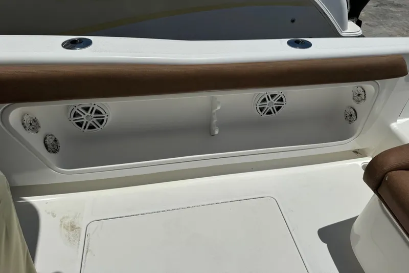Slide: The Image of 2010 Deep Impact 36 DI boat interior with speakers and seating. - 2