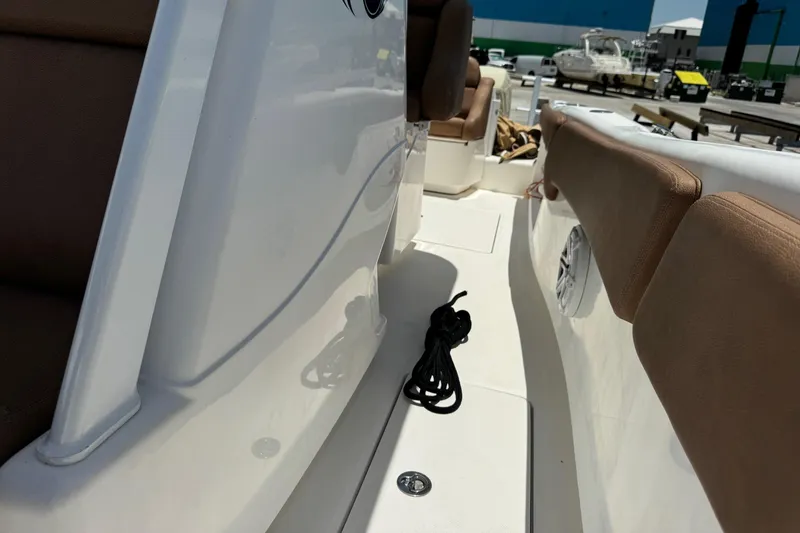 Slide: The Image of 2010 Deep Impact 36 DI boat interior with seating and coiled rope on deck. - 20