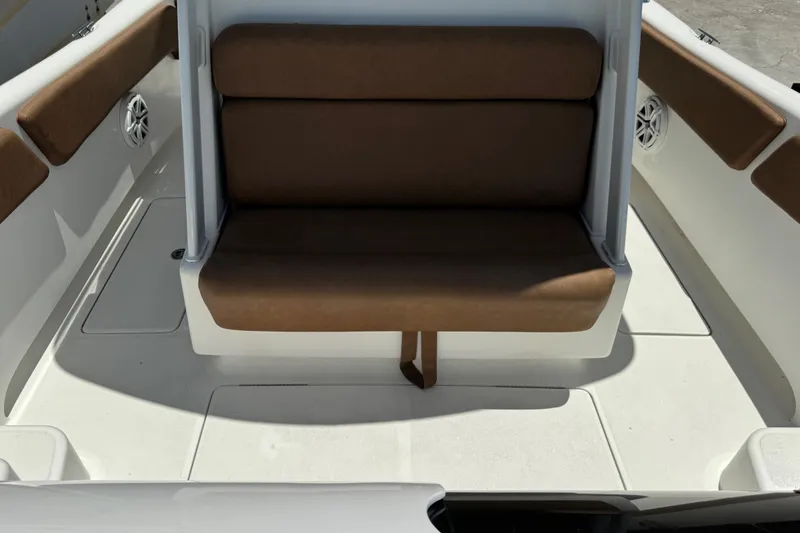 Slide: The Image of 2010 Deep Impact 36 DI boat interior with brown seating and white deck. - 22