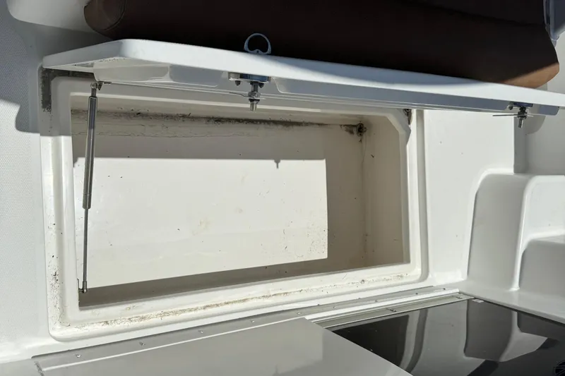 Slide: The Image of Open storage compartment on a 2010 Deep Impact 36 DI boat. - 23
