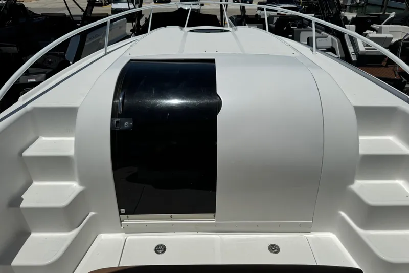 Slide: The Image of 2010 Deep Impact 36 DI boat deck with sleek design and black hatch. - 24